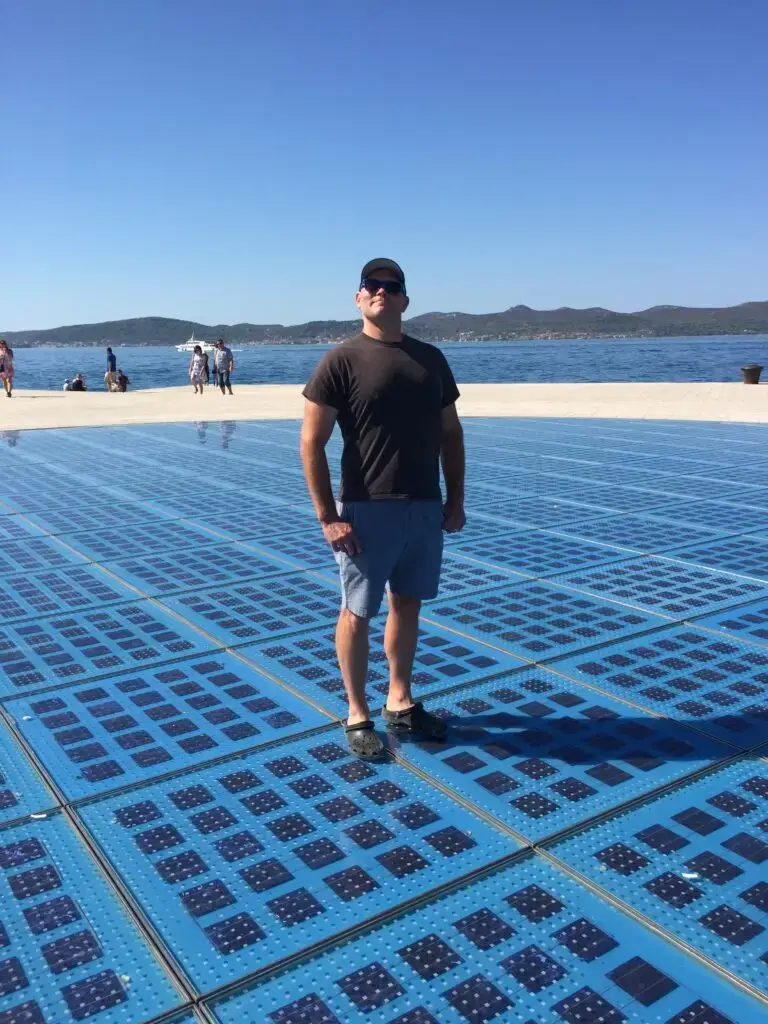 Jamie standing on the Sun Salutation